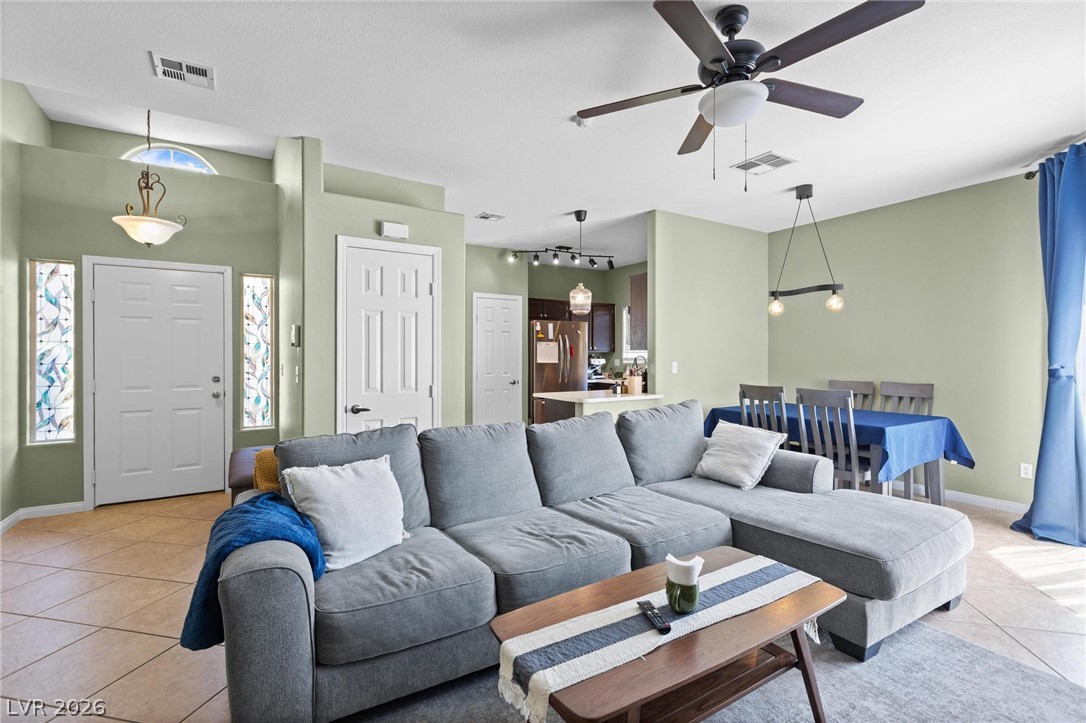 3238 Mystic Ridge Court Las Vegas, NV 89129 - Photo 1 of 31 An inviting open-concept living space features a cozy seating area and a casual dining nook.