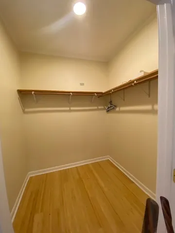 a kitchen with granite countertop a sink stove and cabinets