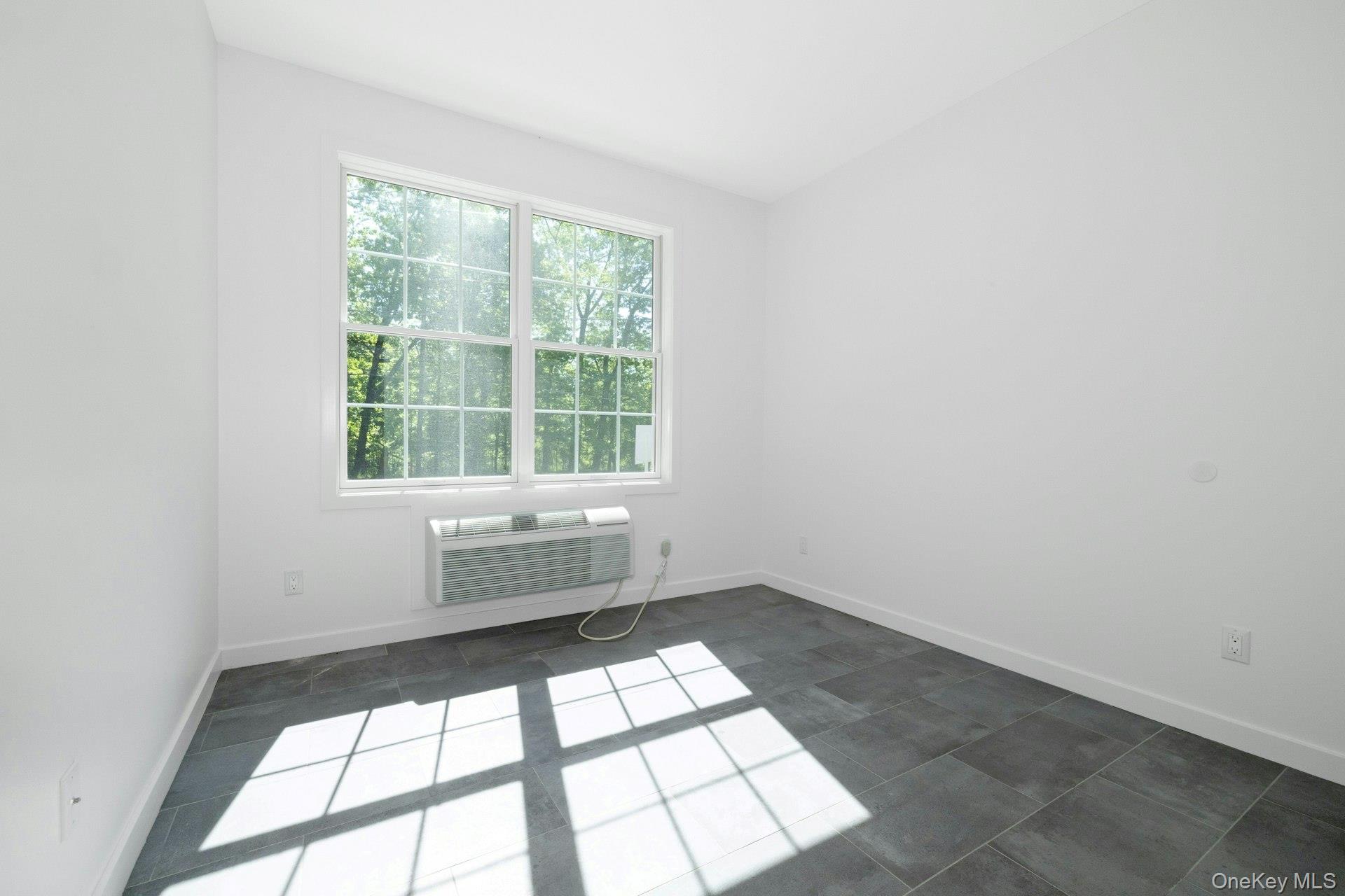 962 Rte 9W, Unit 106 Congers, NY 10920 - Photo 12 of 48 an empty room with a window