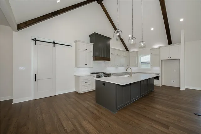 a kitchen with a sink and a refrigerator