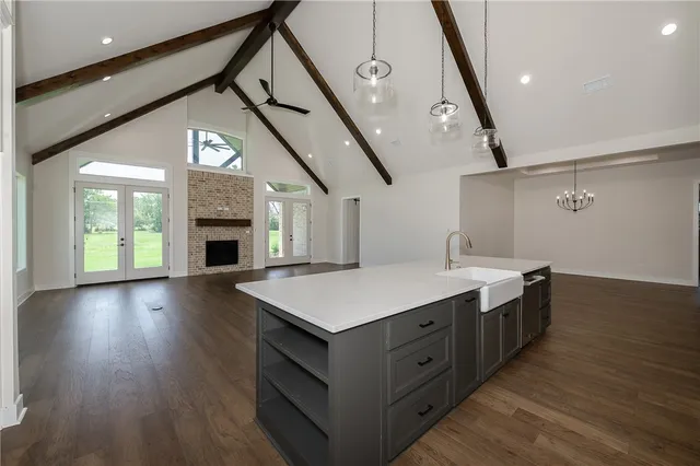 a kitchen with a stove and a wooden floors