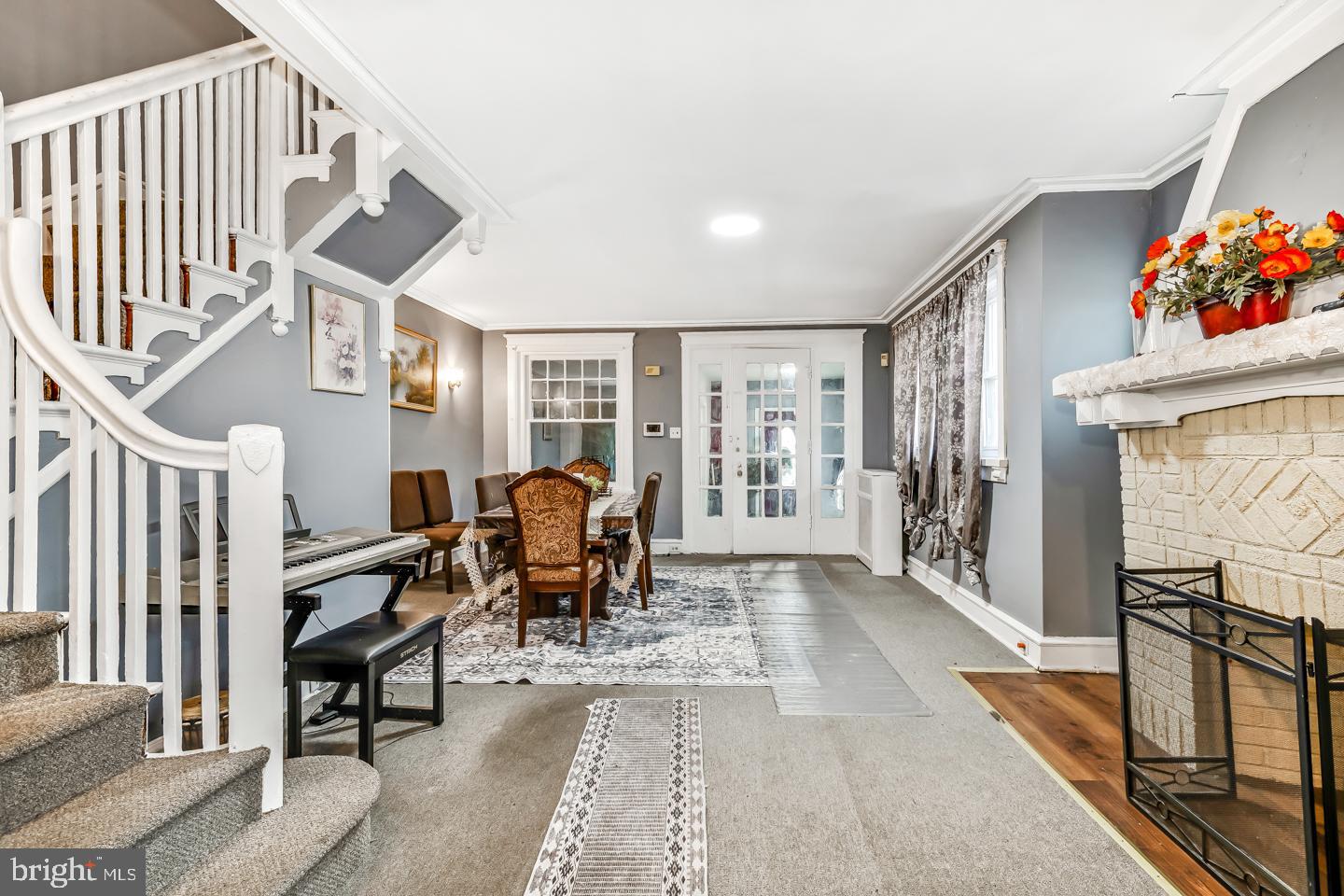 6243 Carpenter Street Philadelphia, PA 19143 - Photo 11 of 55 a living room with fireplace furniture and a window
