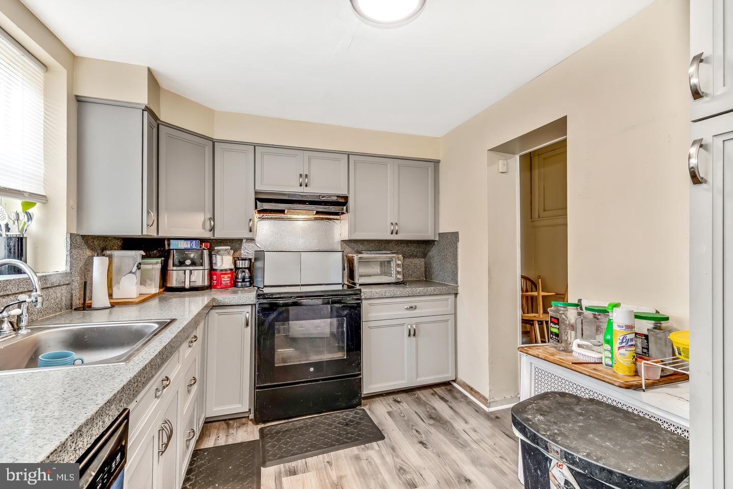 6243 Carpenter Street Philadelphia, PA 19143 - Photo 18 of 55 a kitchen with stainless steel appliances granite countertop a sink dishwasher stove refrigerator and cabinets