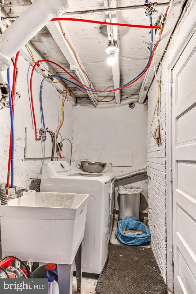 6243 Carpenter Street Philadelphia, PA 19143 - Photo 22 of 55 a utility room with a sink and a mirror