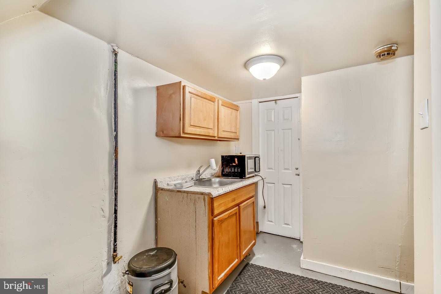 6243 Carpenter Street Philadelphia, PA 19143 - Photo 28 of 55 a view of a storage & utility room with a sink