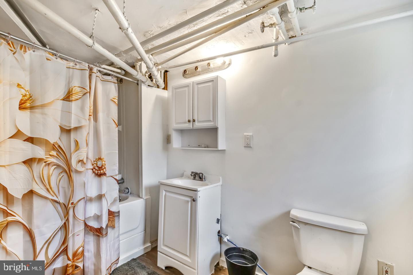 6243 Carpenter Street Philadelphia, PA 19143 - Photo 30 of 55 a bathroom with a sink toilet and shower