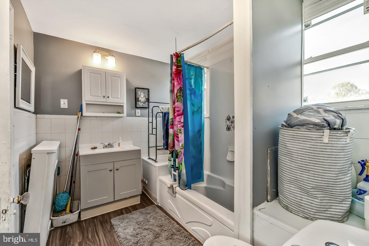 6243 Carpenter Street Philadelphia, PA 19143 - Photo 35 of 55 a bathroom with a sink a toilet and shower