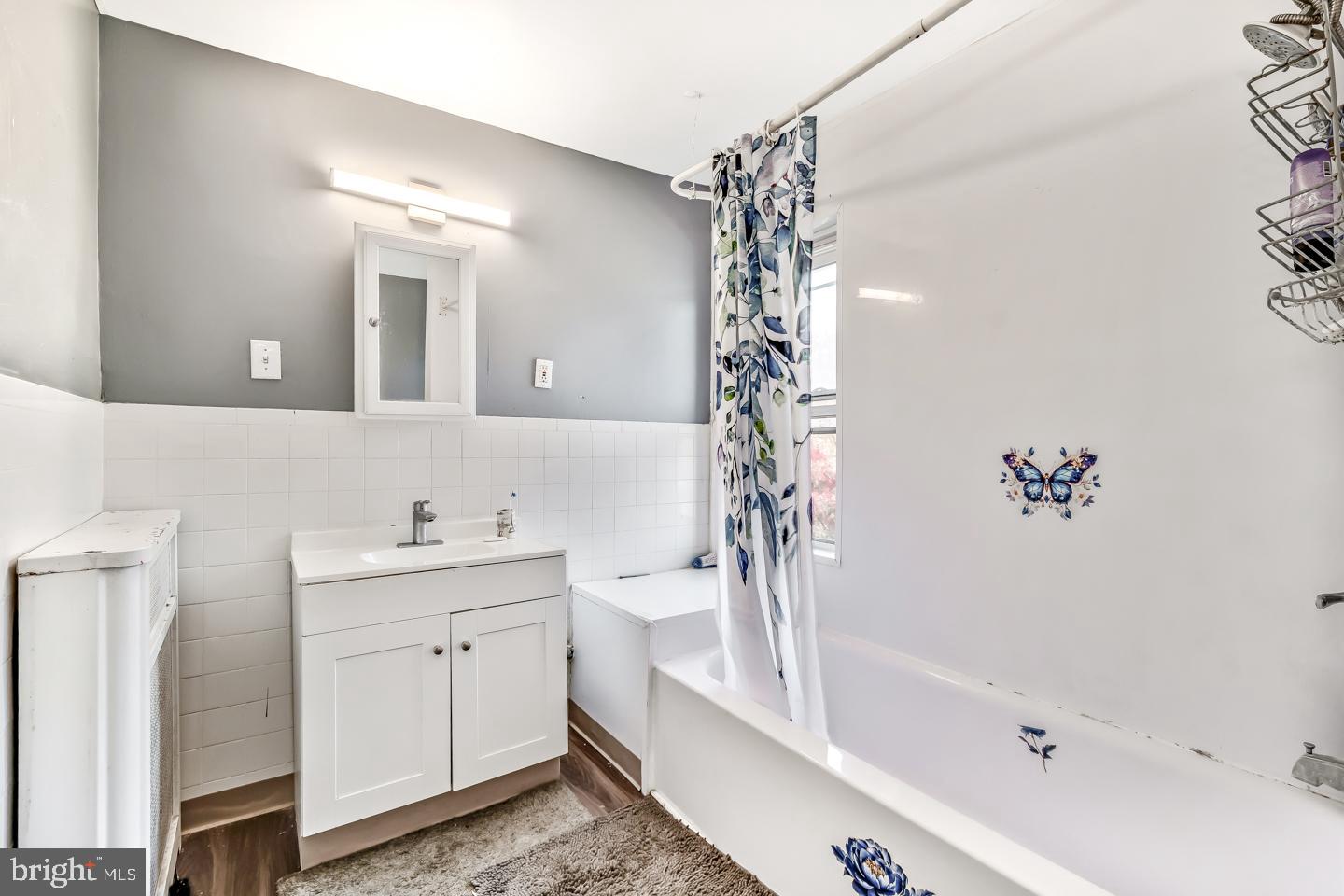 6243 Carpenter Street Philadelphia, PA 19143 - Photo 45 of 55 a bathroom with a bathtub a sink and a shower