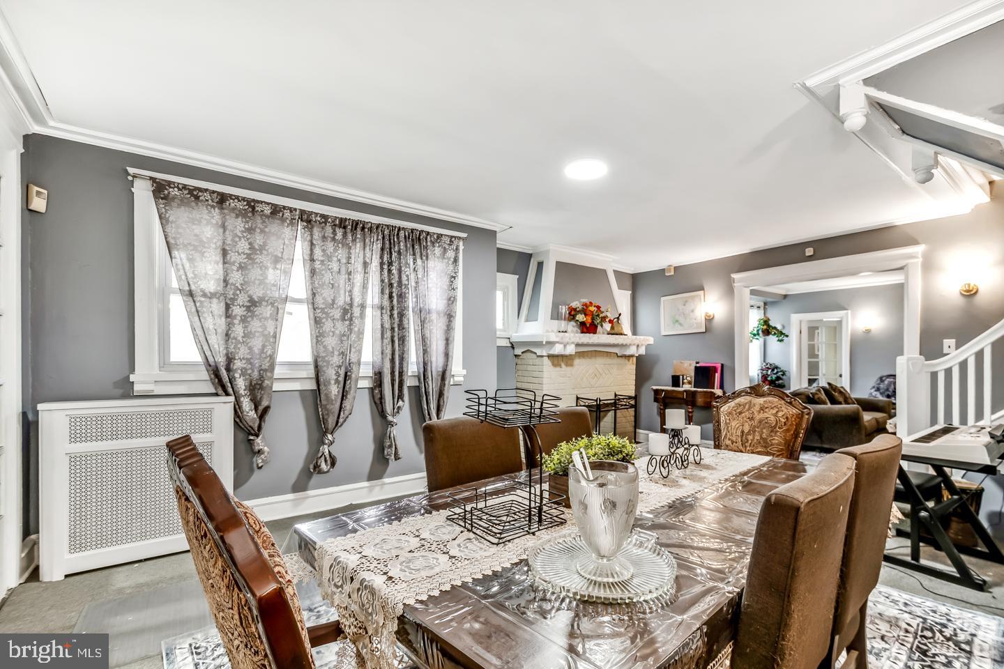 6243 Carpenter Street Philadelphia, PA 19143 - Photo 8 of 55 a dining room with furniture a rug and wooden floor