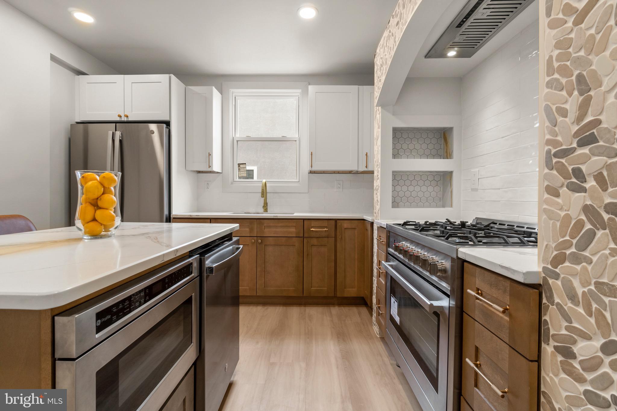 325 East 2nd Street Moorestown, NJ 08057 - Photo 12 of 39 a kitchen with a stove a sink dishwasher and a refrigerator