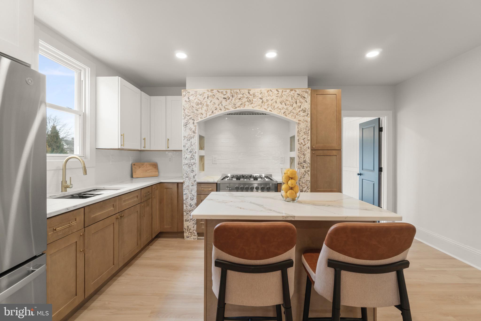 325 East 2nd Street Moorestown, NJ 08057 - Photo 14 of 39 a kitchen with a table chairs a sink and a window