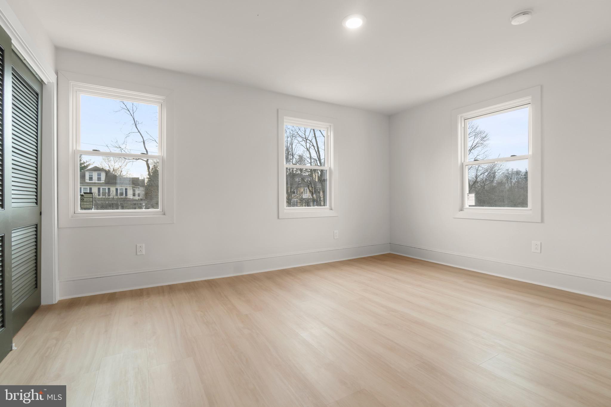 325 East 2nd Street Moorestown, NJ 08057 - Photo 20 of 39 a view of an empty room with wooden floor and a window