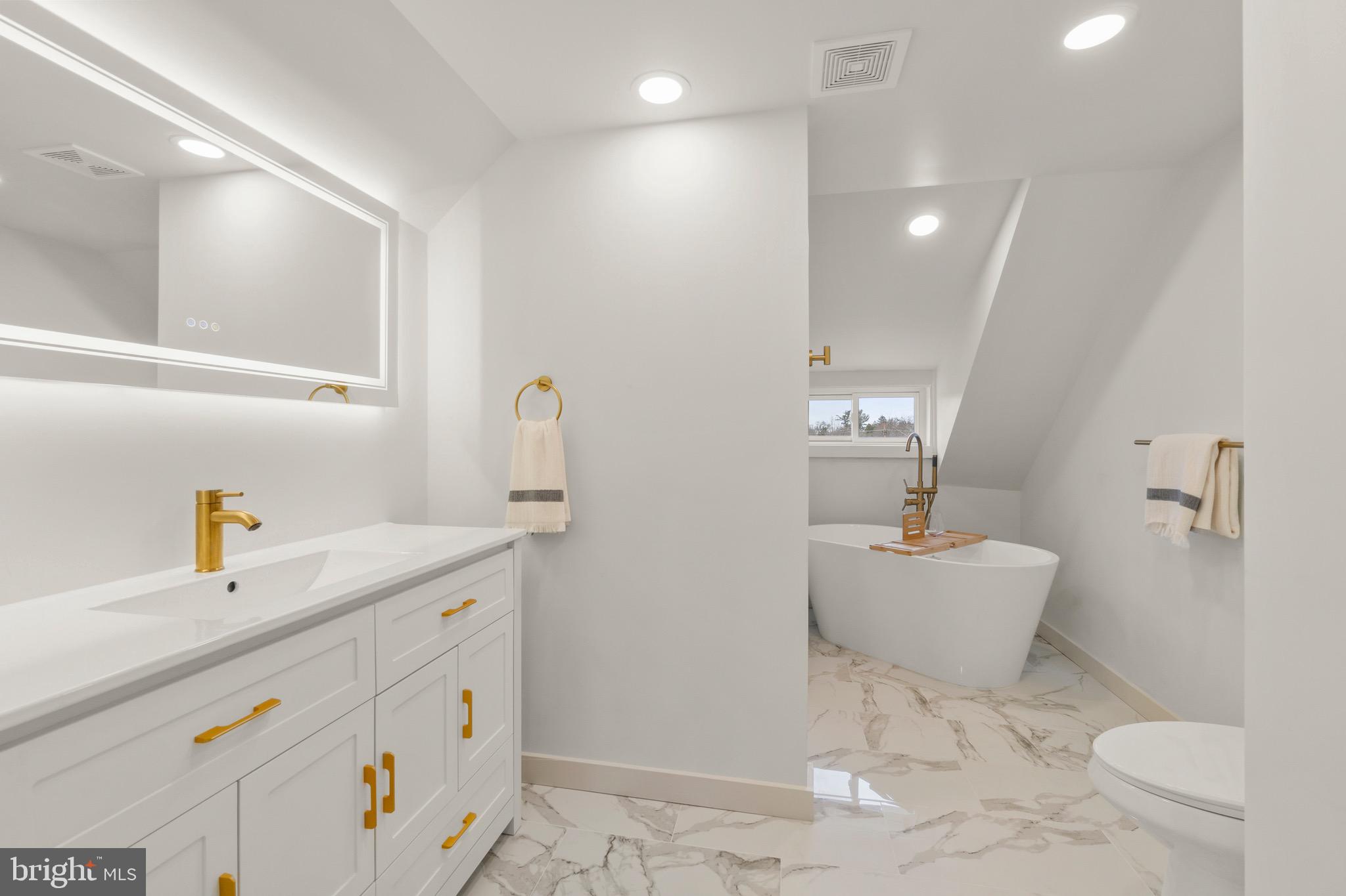 325 East 2nd Street Moorestown, NJ 08057 - Photo 24 of 39 a bathroom with a sink a toilet and a mirror