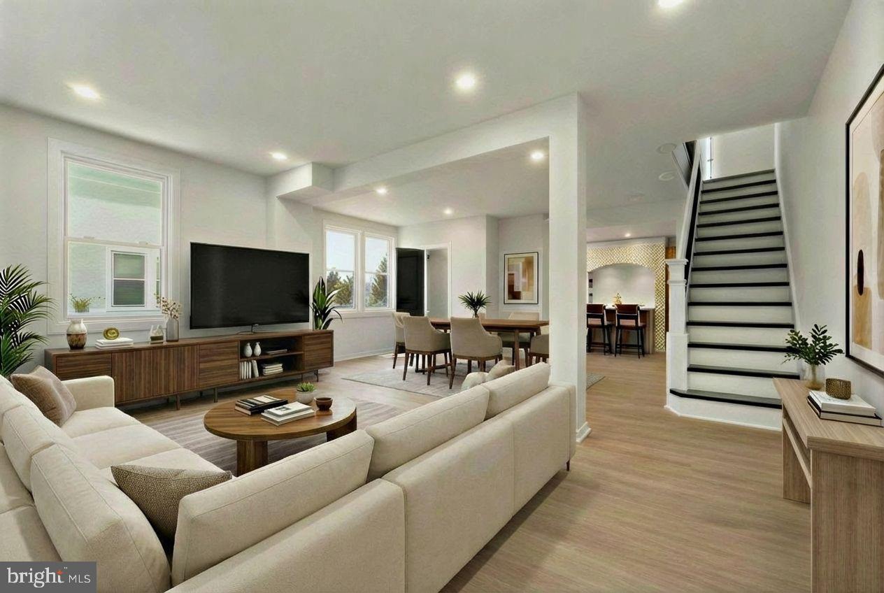325 East 2nd Street Moorestown, NJ 08057 - Photo 36 of 39 a living room with furniture kitchen view and a flat screen tv