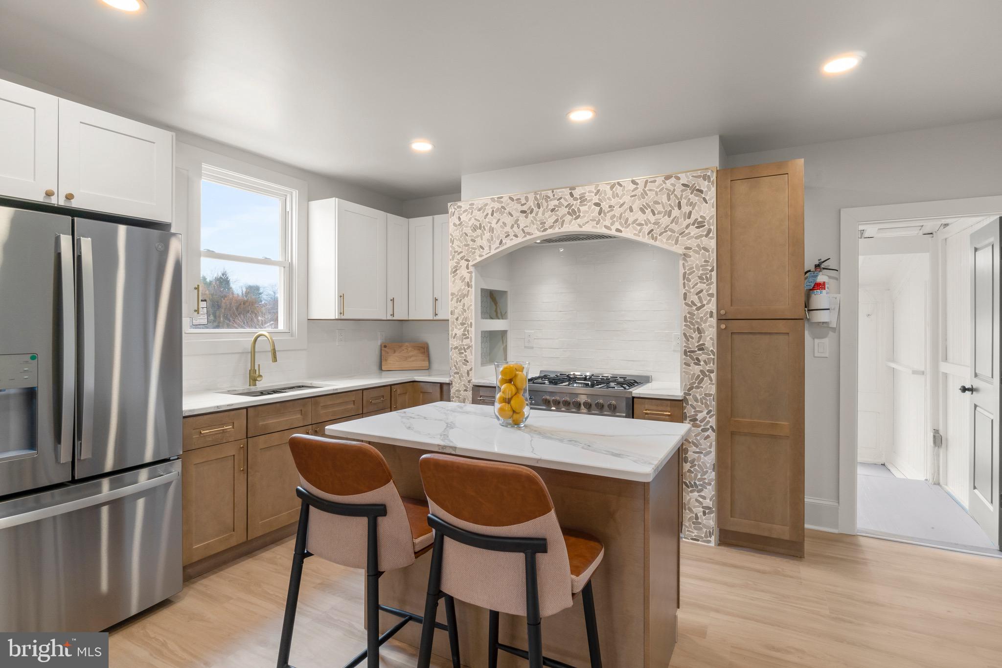 325 East 2nd Street Moorestown, NJ 08057 - Photo 8 of 39 a kitchen with refrigerator a sink and chairs