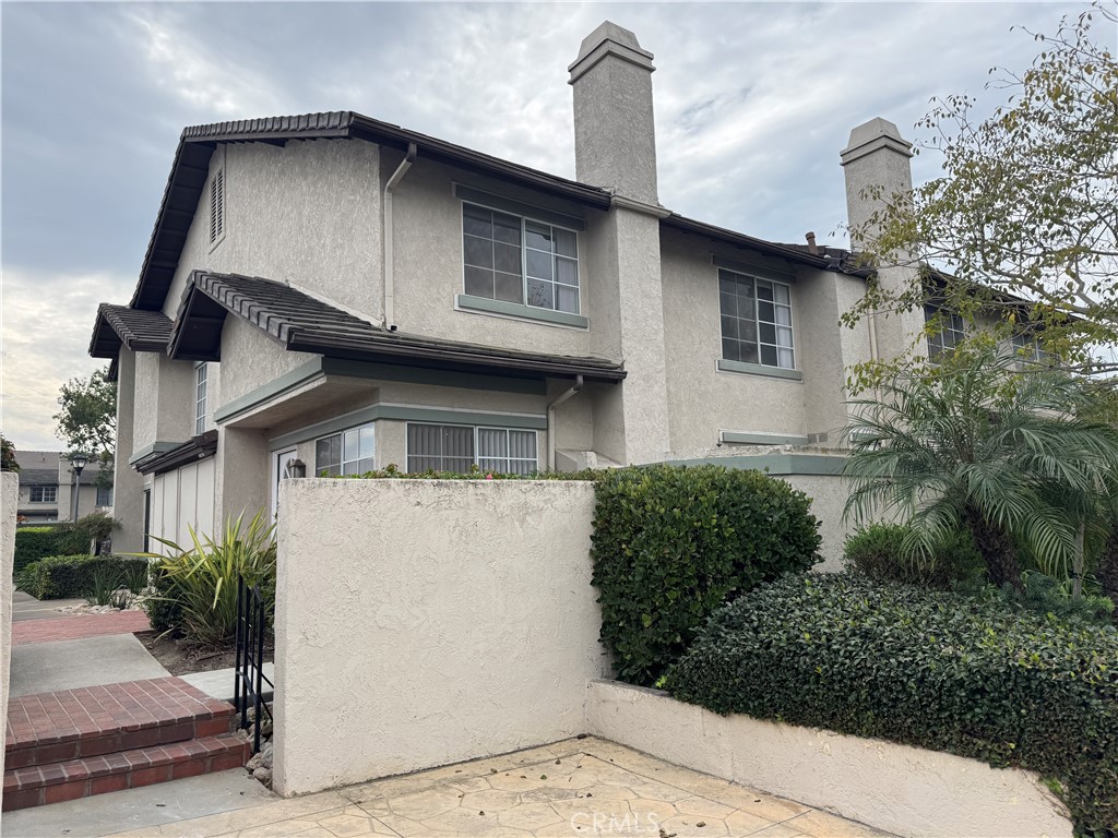 6 Columbia, Unit 2 Irvine, CA 92612 - Photo 2 of 25 a front view of a house with garden