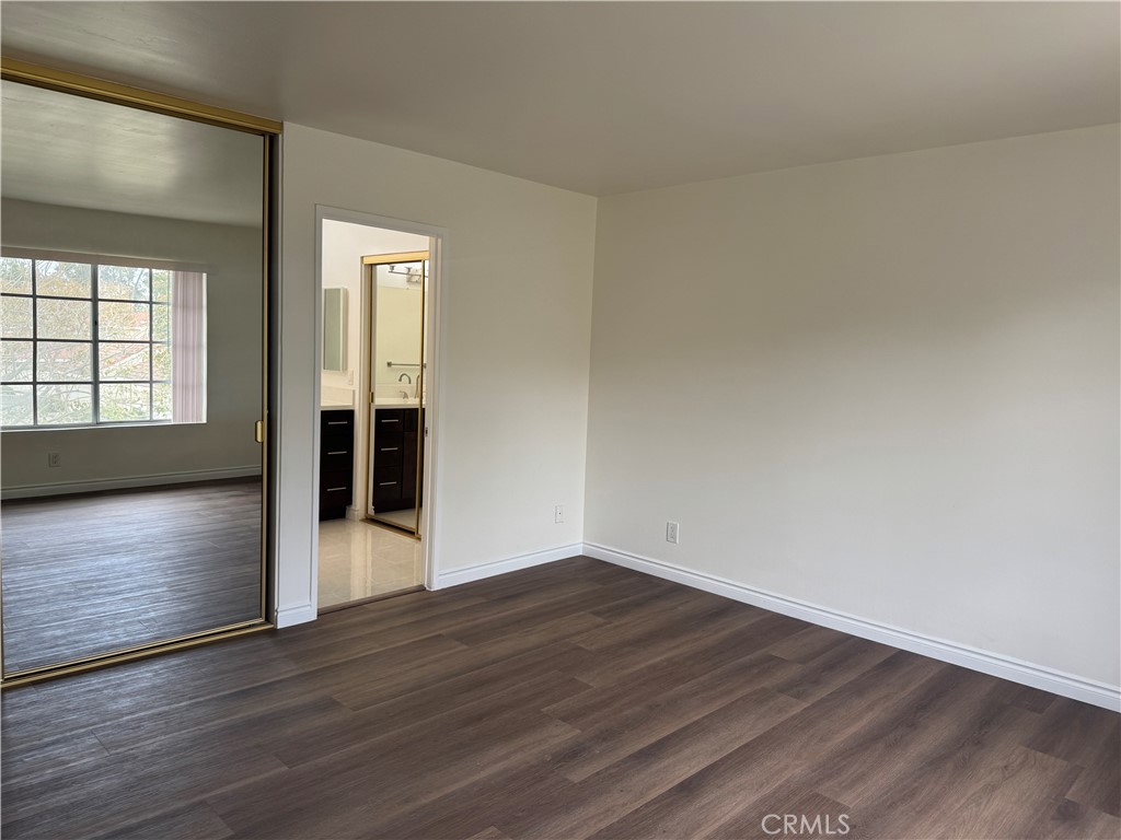 6 Columbia, Unit 2 Irvine, CA 92612 - Photo 22 of 25 a view of empty room with wooden floor and fan