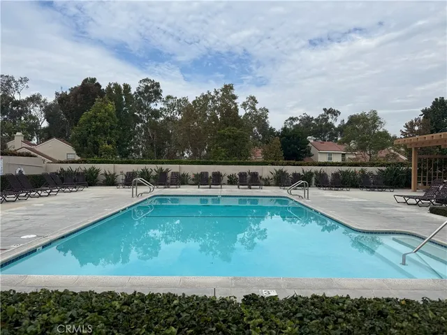 a view of a swimming pool with a yard