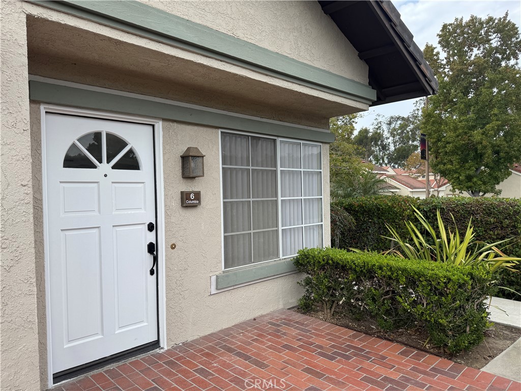 6 Columbia, Unit 2 Irvine, CA 92612 - Photo 4 of 25 a front view of a house with garden
