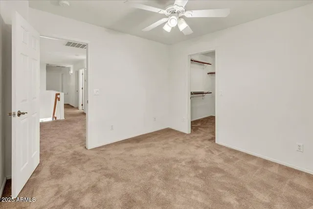 wooden floor in an empty room and a bathroom