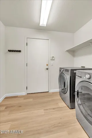 a view of a storage & utility room with washer and dryer