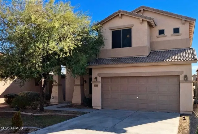 a front view of a house with a garage