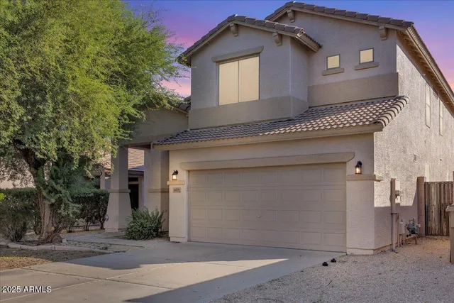 a front view of a house with a garage