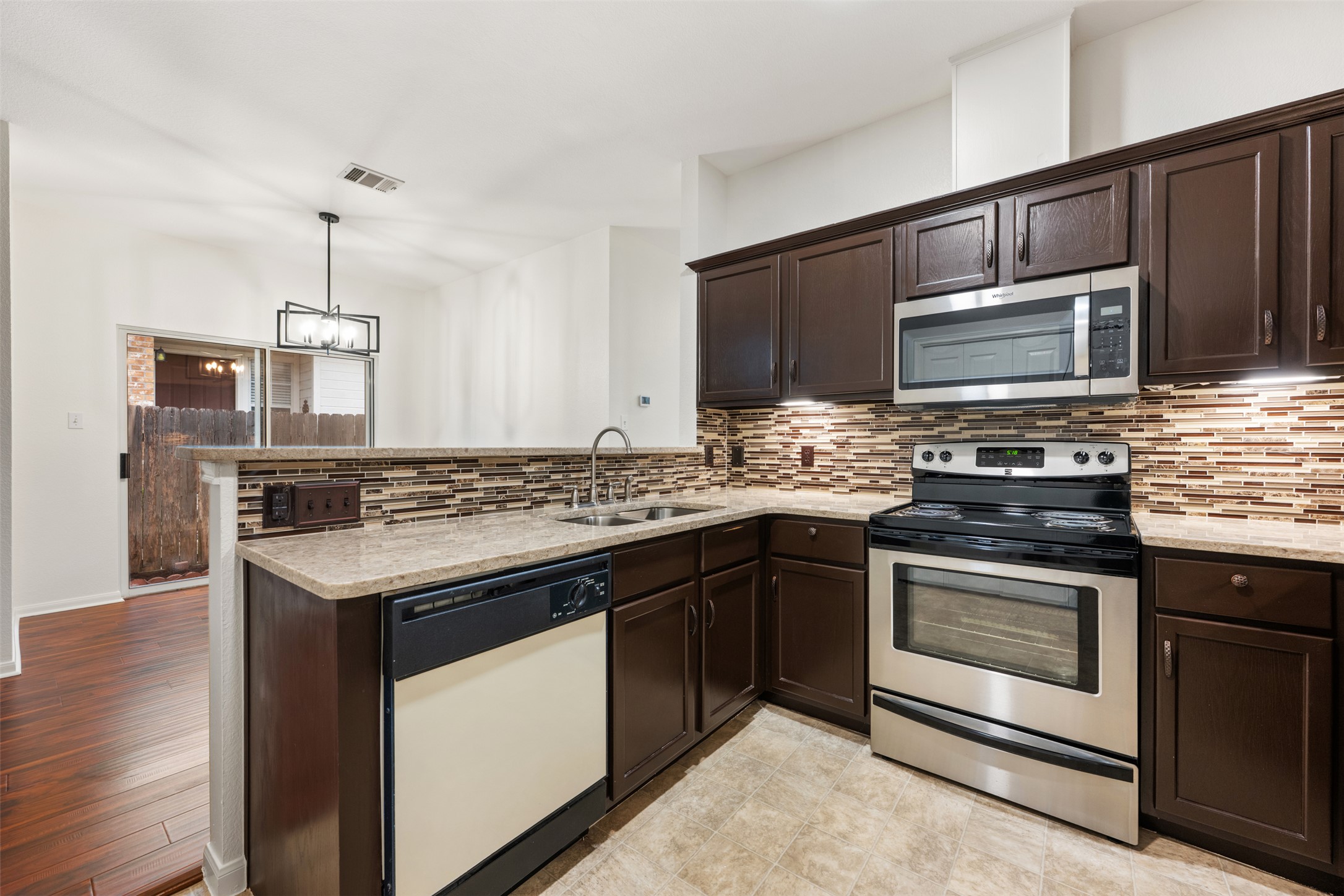 a kitchen with a stove and a microwave