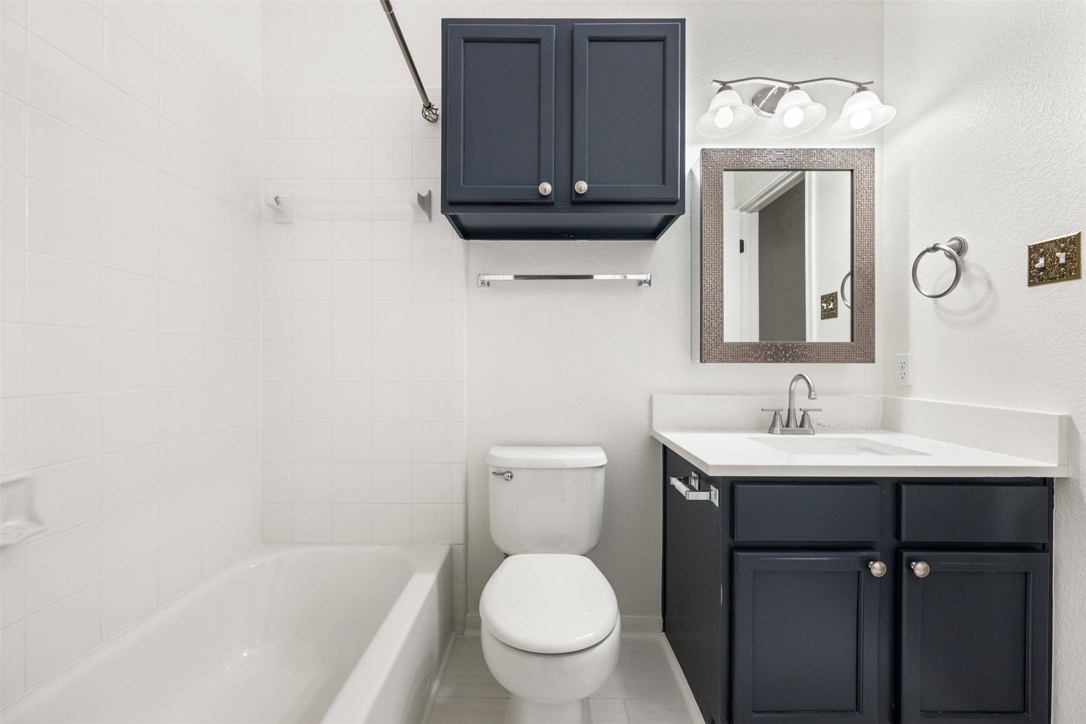 2429 A Curry Loop Round Rock, TX 78664 - Photo 11 of 28 a bathroom with a toilet a sink and a mirror