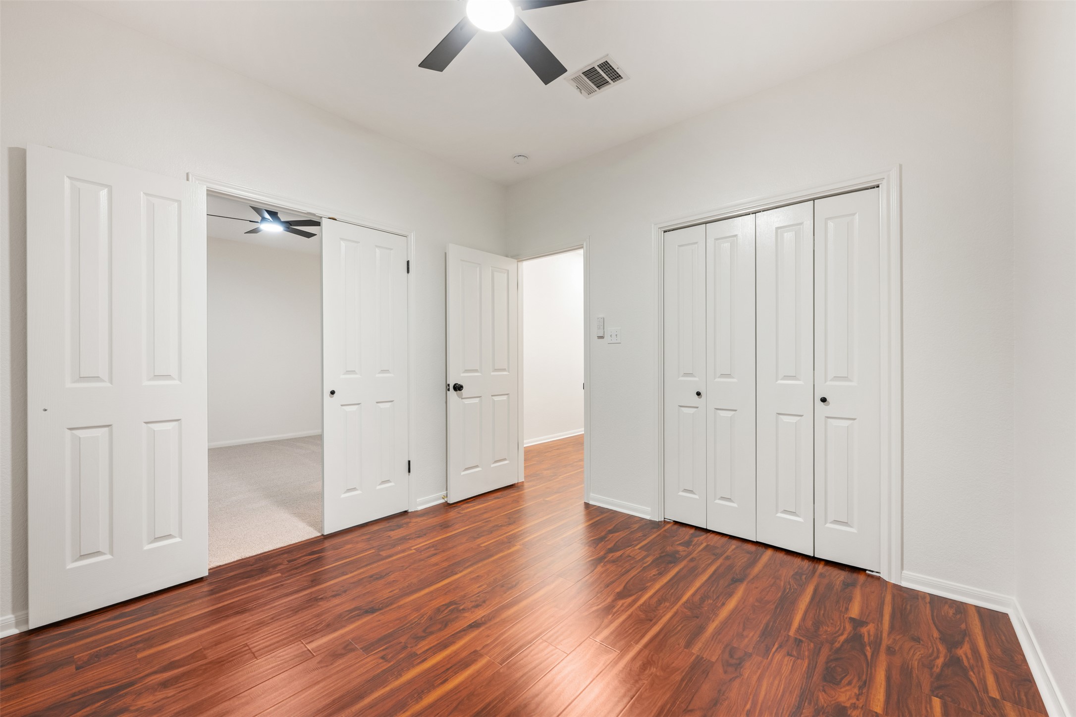 2429 A Curry Loop Round Rock, TX 78664 - Photo 15 of 28 a view of an empty room with wooden floor