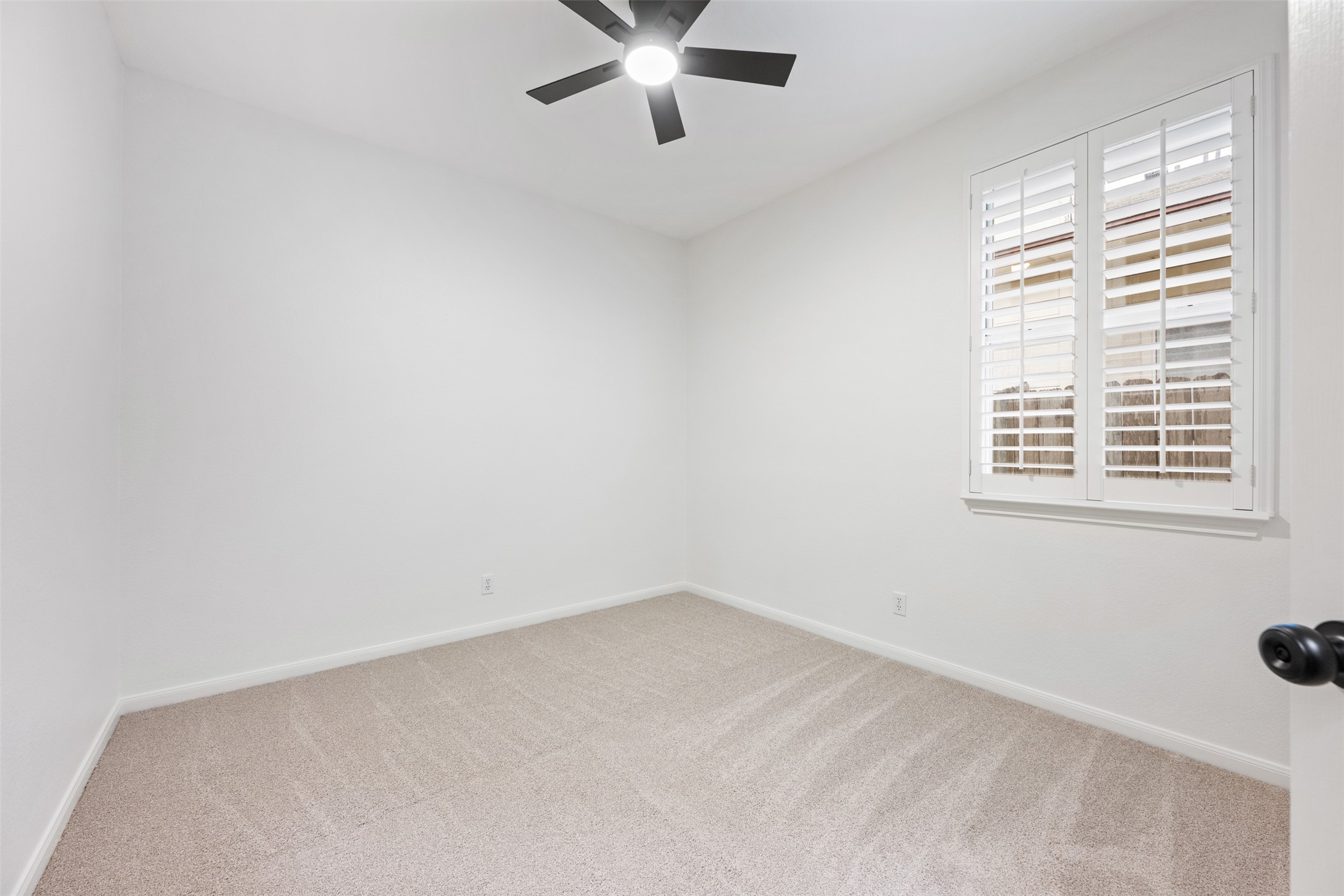 2429 A Curry Loop Round Rock, TX 78664 - Photo 16 of 28 an empty room with windows and ceiling fan