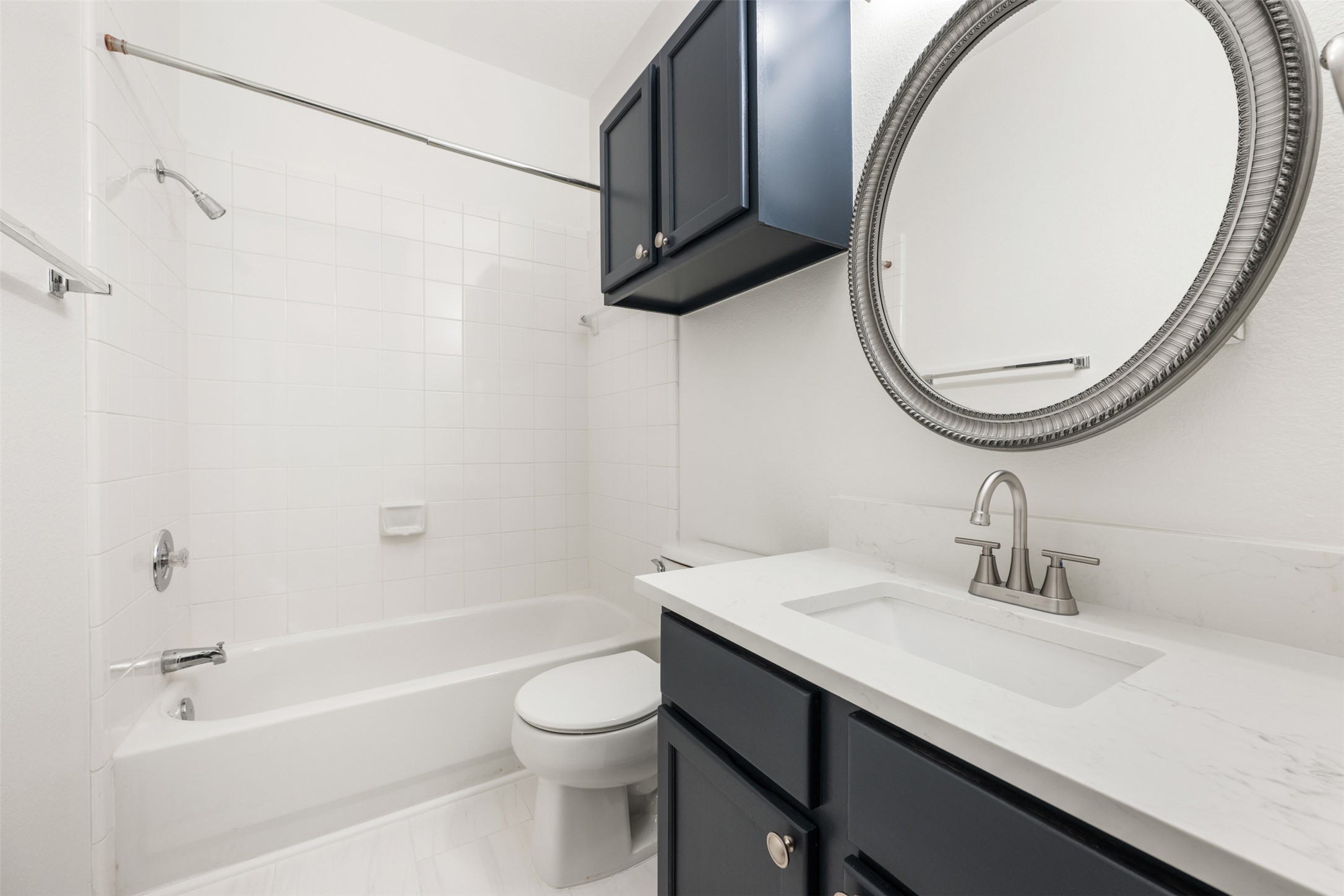 2429 A Curry Loop Round Rock, TX 78664 - Photo 17 of 28 a bathroom with a sink a toilet and a mirror