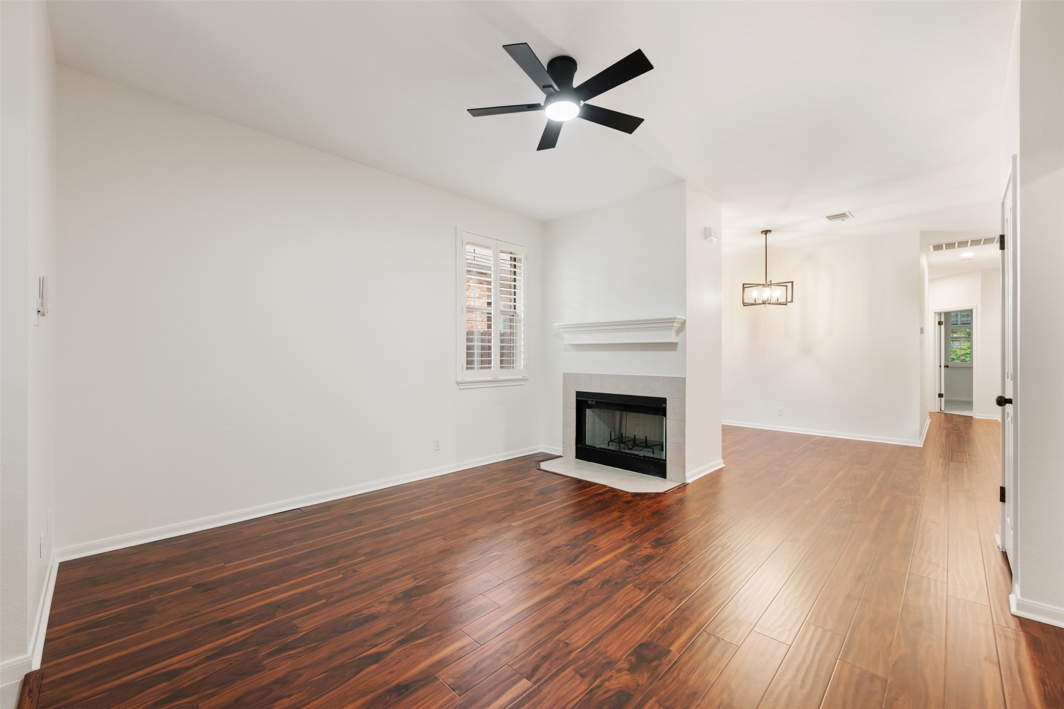 2429 A Curry Loop Round Rock, TX 78664 - Photo 21 of 28 a view of empty room with wooden floor and fireplace