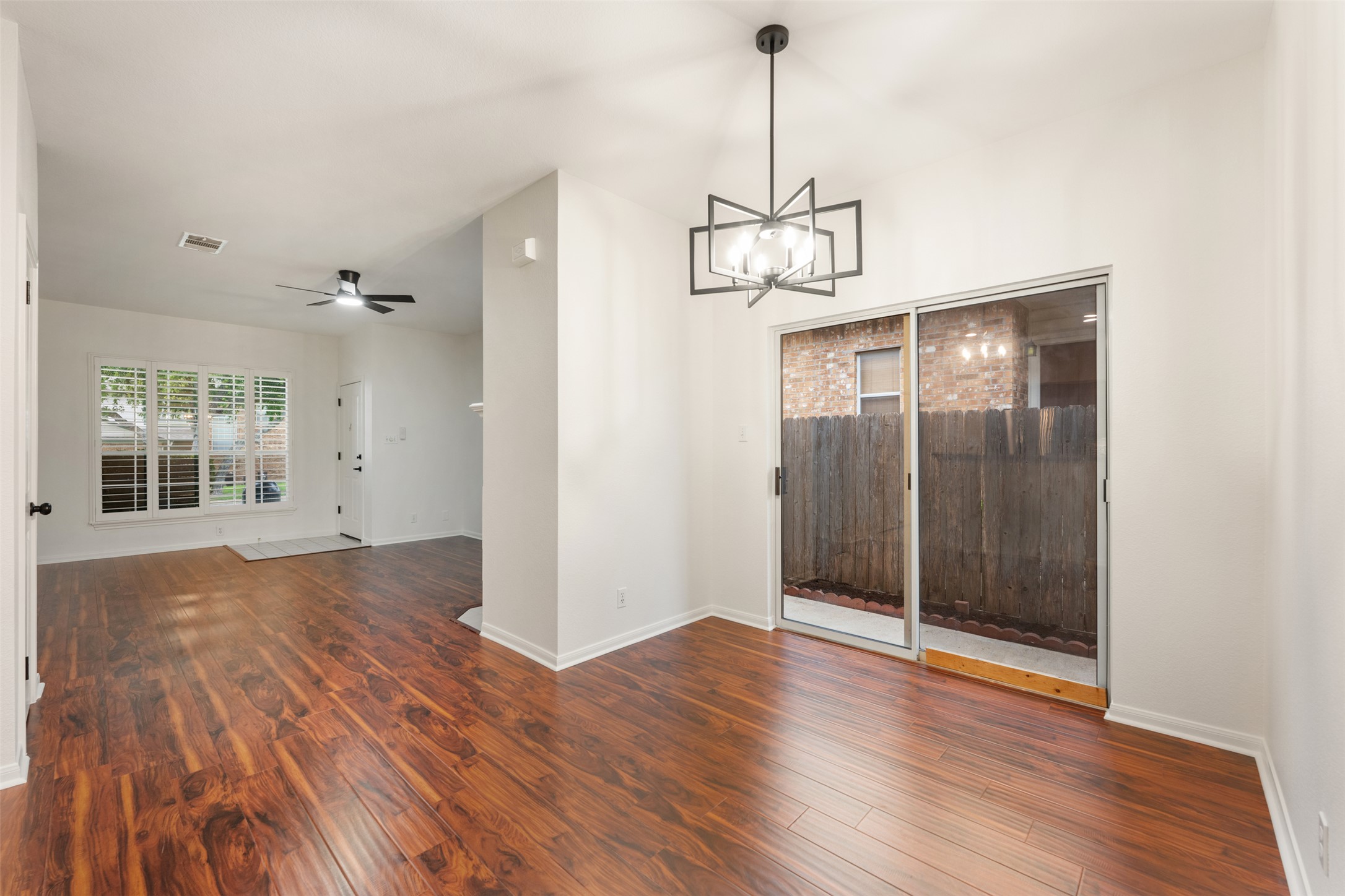 2429 A Curry Loop Round Rock, TX 78664 - Photo 23 of 28 a view of empty room with wooden floor and window