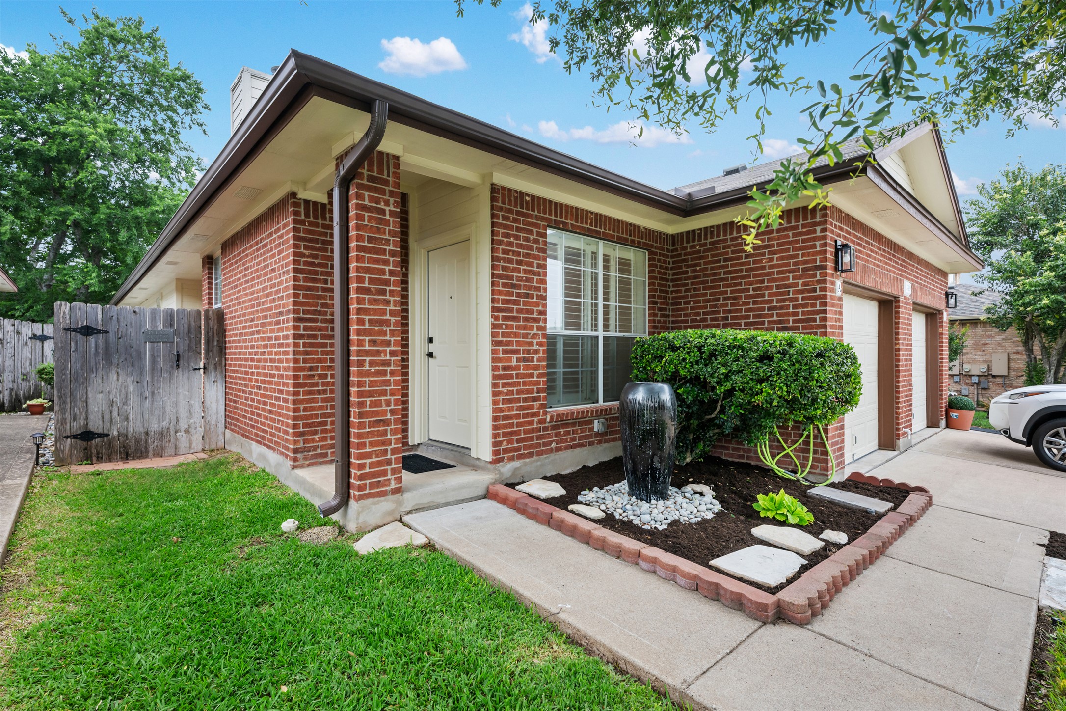 2429 A Curry Loop Round Rock, TX 78664 - Photo 28 of 28 a front view of a house with garden