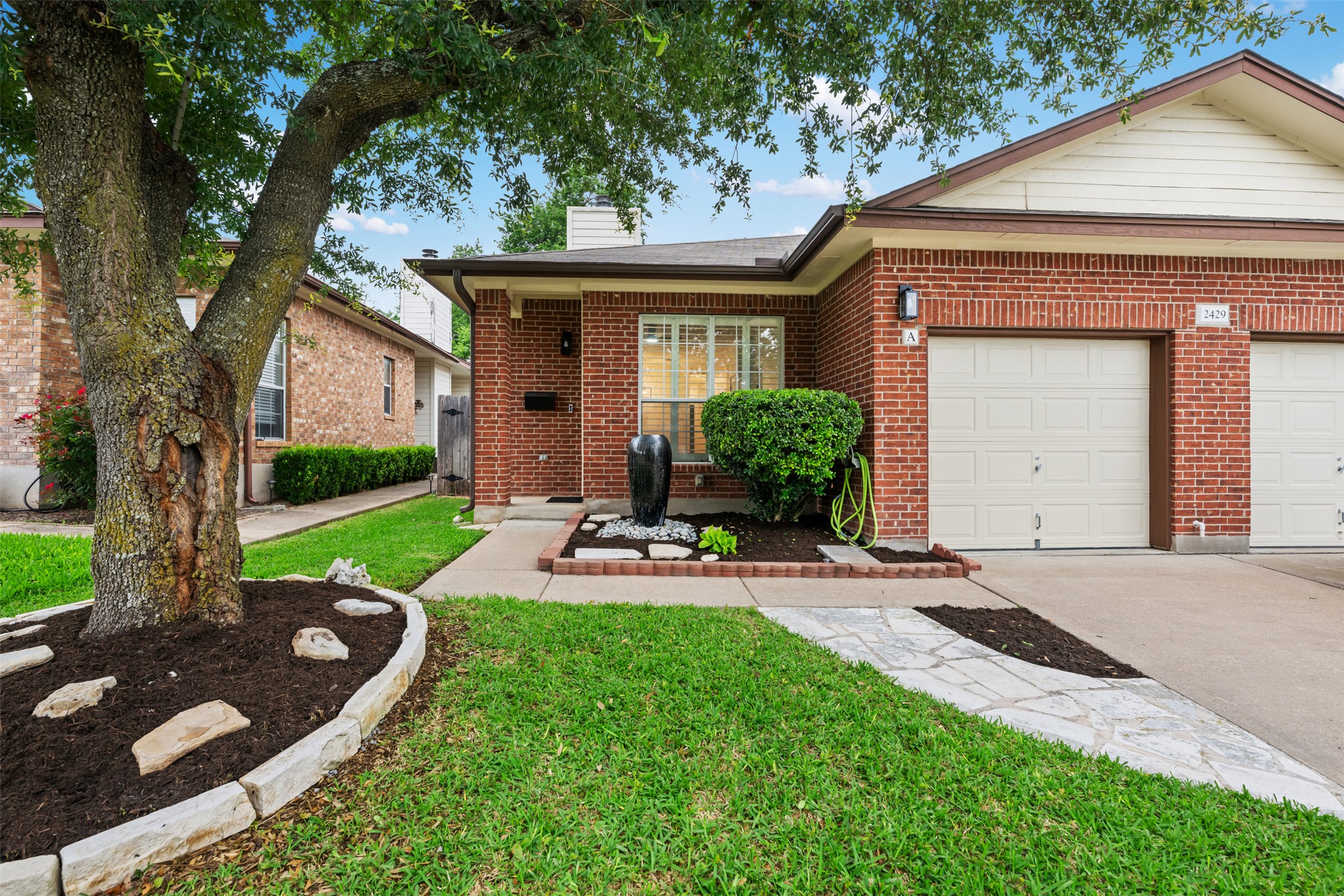 2429 A Curry Loop Round Rock, TX 78664 - Photo 3 of 28 a view of a house with backyard sitting area and garden