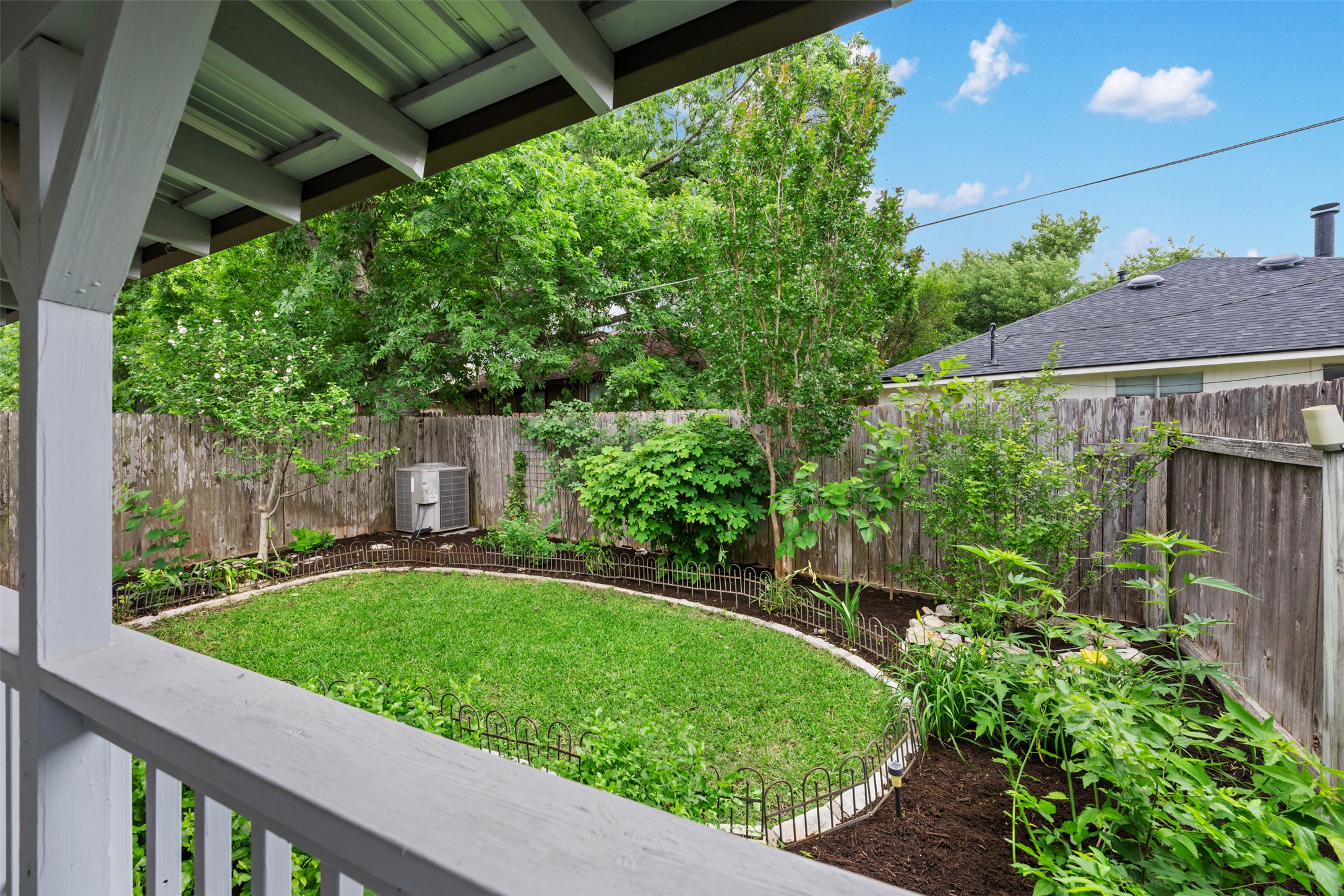 2429 A Curry Loop Round Rock, TX 78664 - Photo 4 of 28 a view of a backyard with potted plants and large tree