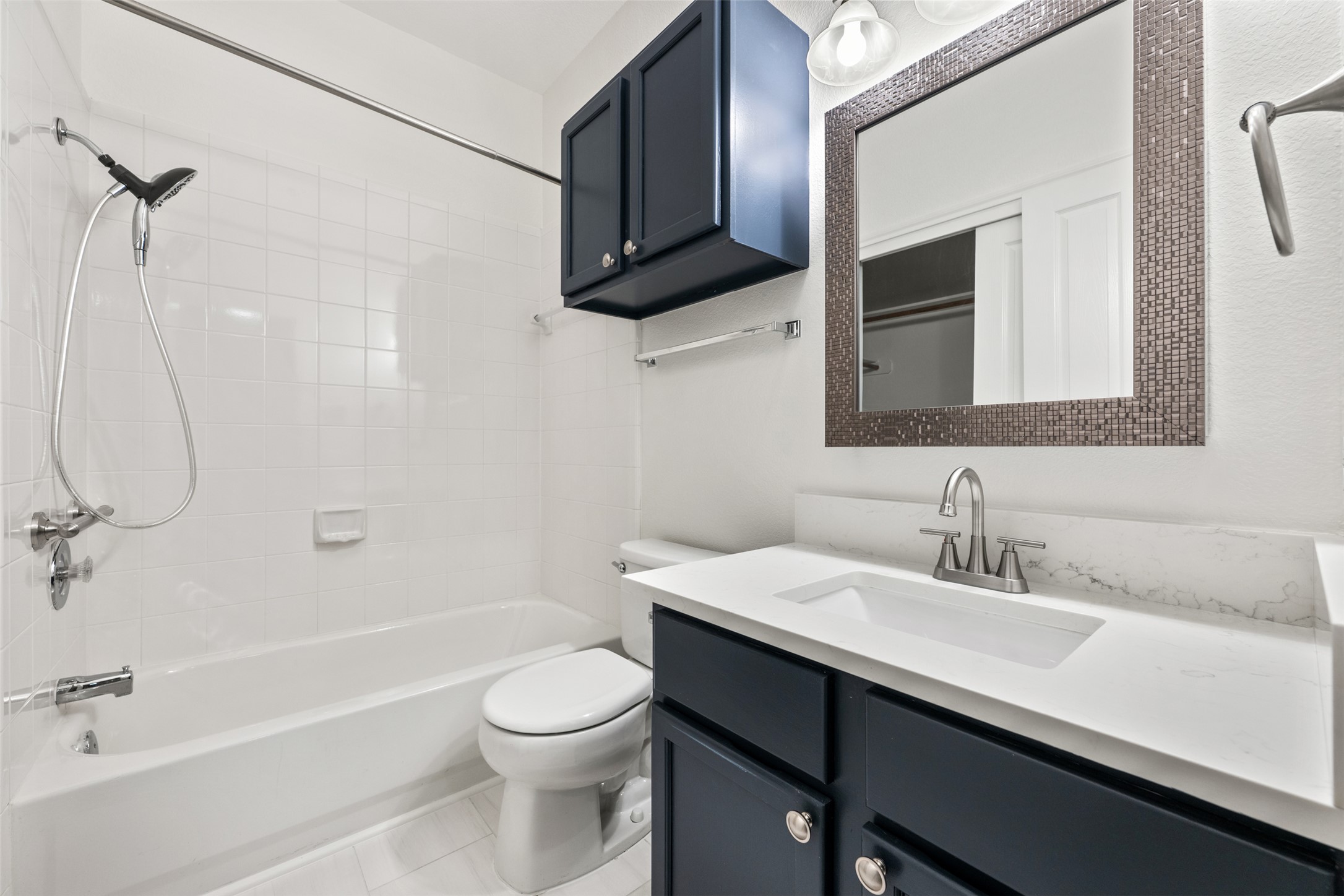 2429 A Curry Loop Round Rock, TX 78664 - Photo 10 of 28 a bathroom with a sink a toilet and shower