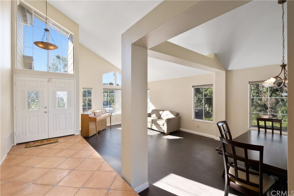 16500 Brightridge Lane Riverside, CA 92503 - Photo 1 of 1 The sunken living room features laminate flooring and offers a unique division between the living and dining rooms.