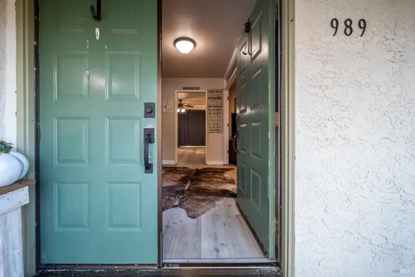 a kitchen with stainless steel appliances granite countertop a sink dishwasher stove and cabinets with wooden floor