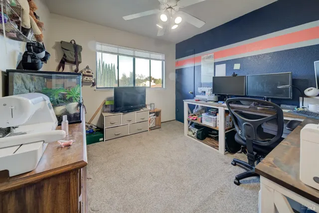 a room with furniture and a flat screen tv