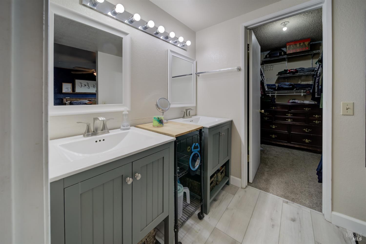 989 Suffolk Way Fairfield, CA 94533 - Photo 28 of 31 a bathroom with a sink double vanity and a shower