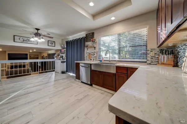 a living room with furniture a fireplace and a television