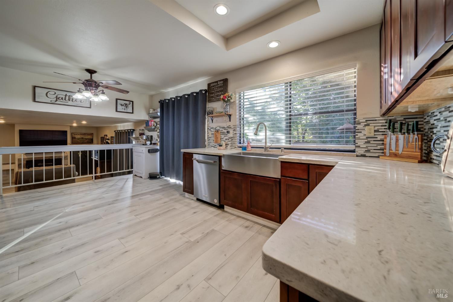 989 Suffolk Way Fairfield, CA 94533 - Photo 6 of 31 a large kitchen with stainless steel appliances granite countertop a large counter top a stove and a wooden floors