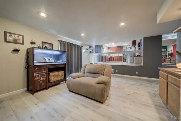 a bathroom with a toilet sink vanity tub and mirror