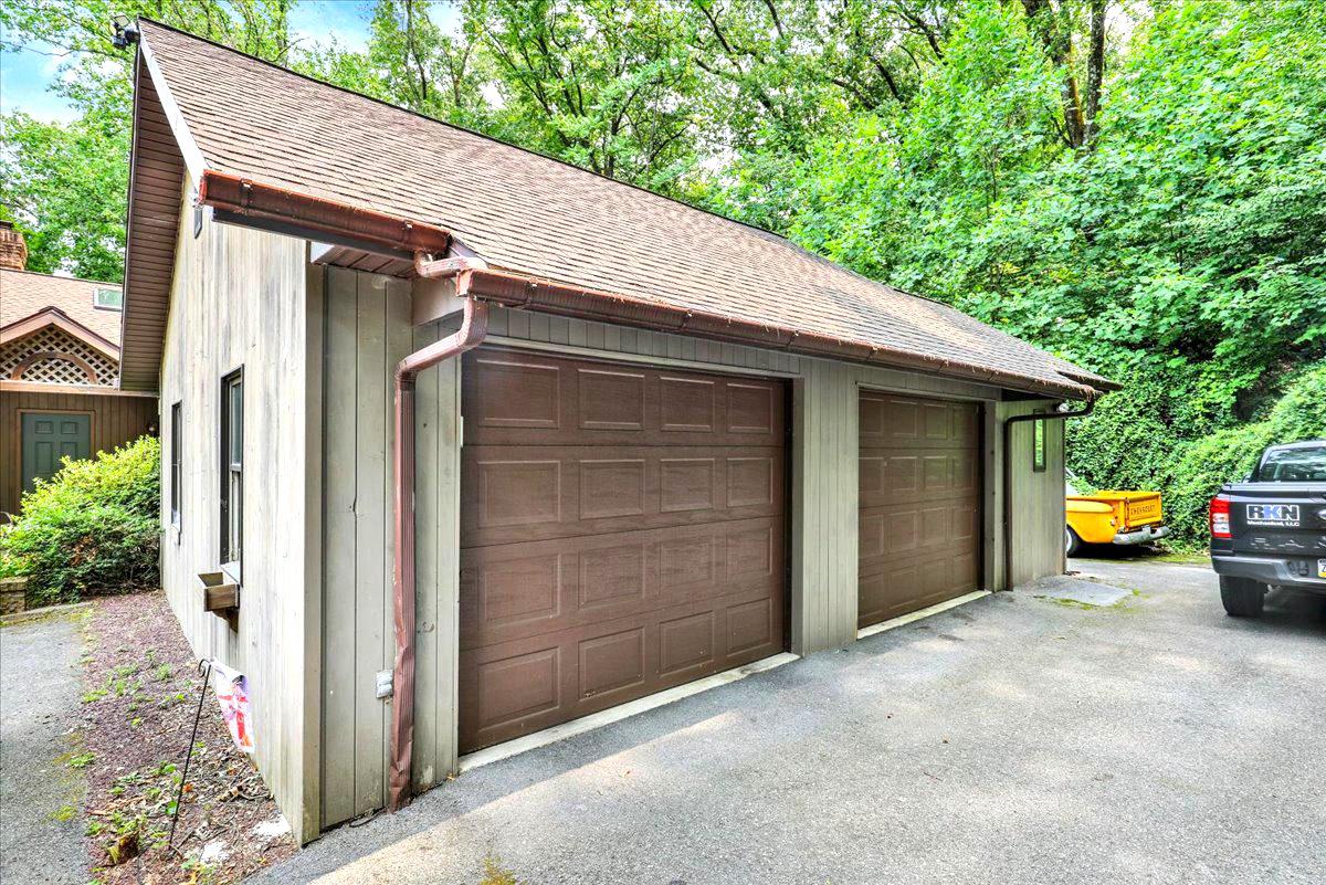 126 West Neversink Road Reading, PA 19606 - Photo 37 of 40 Oversized 2 car garage nestled in nature.