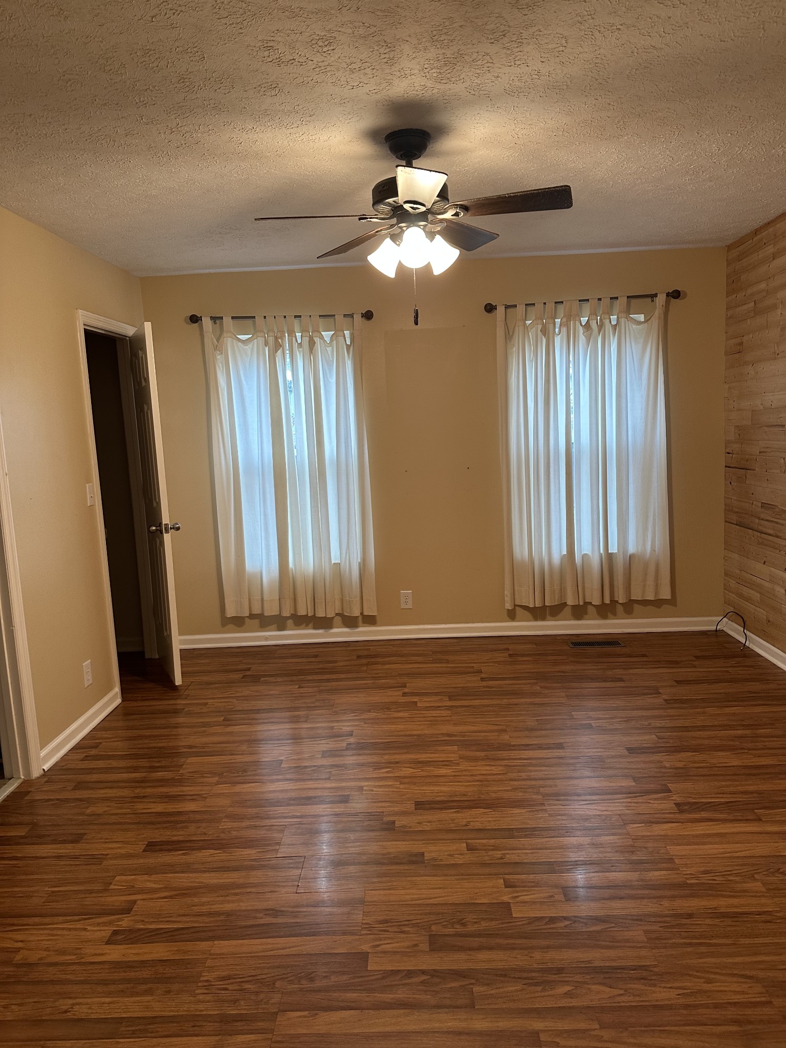 1612 Cedar Tree Lane Mount Juliet, TN 37122 - Photo 4 of 7 wooden floor in an empty room with a window