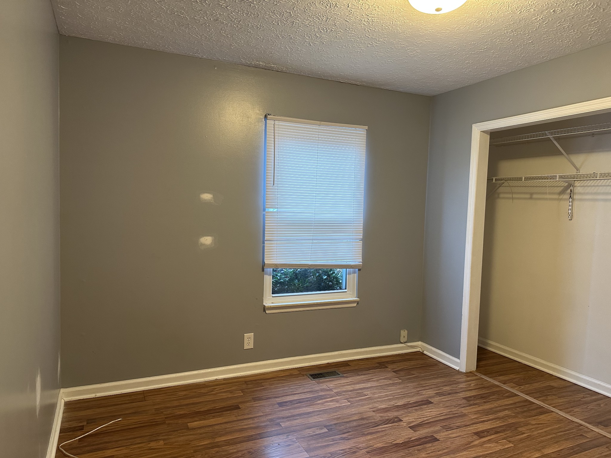 1612 Cedar Tree Lane Mount Juliet, TN 37122 - Photo 5 of 7 an empty room with wooden floor and windows