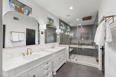 a bathroom with a bathtub and shower