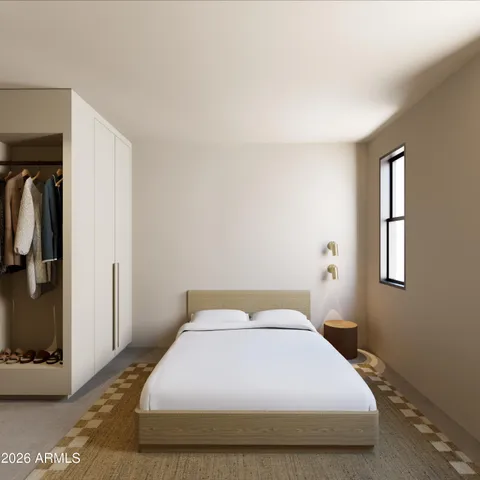 a bedroom with a bed and a window